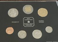 Front view of seven Canadian coins from the 2000 specimen set in a black display case by the Royal Canadian Mint.