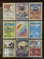 Front view of nine Pokémon trading cards arranged in a 3x3 sheet inside a protective sleeve with character names and details.