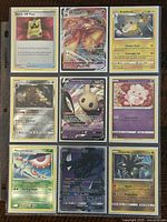 Nine Pokémon trading cards displayed in a 3x3 grid, showing various characters and card details.