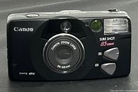 Front view of the Canon Sure Shot 85 Zoom camera showing lens, flash, and buttons.