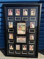 Framed display of the 1961 New York Yankees World Series print card collection including player portraits, signatures, team photo, and central World Series card