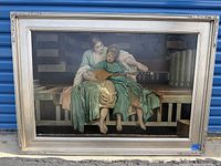 Full view of the framed oil painting showing lady and child with guitar seated on a bench.