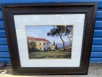 Framed painting showing the Tuscan scenery with a house and trees in warm colors from artist Michael Downs.