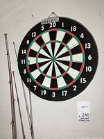 Mounted 18×18-inch dartboard on wall with size label above