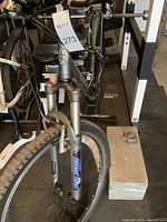 Front view showing Fox suspension forks and knobby front tire