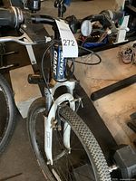 Front view of giant XTC bike showing front tire with knobby Kenda tire tread, white suspension fork, and blue frame with Giant logo.