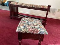 Photo showing both floral fabric upholstered decorative bench and matching storage stool with cherry wood stain on wooden frame.