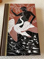 Front cover of Volume 1 showing classical Greek mythological illustration in ochre, black, and white with gold detailing.