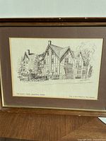 Framed pencil sketch print of The Ellen Osler Memorial Home by Alex Adamson, showing entire frame and print.