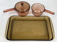 Photo showing two glass saucepans and one large rectangular smoked glass casserole dish