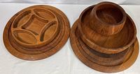Left and right stacked views showing the two large round platters and four bowls stacked.