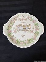 Full top-down view of the Brambly Hedge bread and butter plate showing entire design and shape