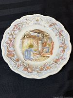 Full view of collector plate showing winter mice illustration and decorated rim
