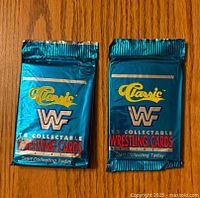Front view of two sealed packs of Classic WWF Wrestling Cards showing brand logo and pack details.