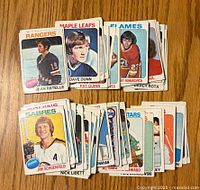 Front sides of the hockey cards showing player portraits and team names including Rangers, Maple Leafs, Flames, Sabres, and Stars.
