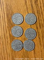 Reverse sides showing '5 cents' and various years with beaver design