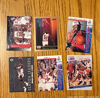 Front side of 6 basketball cards showing Michael Jordan in various action shots and poses, colorful and glossy surfaces, highlighting 1993-94 NBA season details.