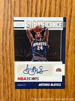 Front view of Antonio McDyess autographed basketball trading card showing player image, autograph, and card branding.