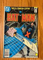 Front cover photo showing Batman issue #298 with character combat scene and 35 cent price.