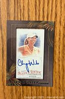 Front side of the 2016 Topps Allen & Ginter golf card featuring Cheyenne Woods with her signature in blue ink and a stylized border with palm leaves.
