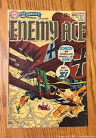 Front cover of Star Spangled War Stories #148 comic book showing WWII aerial combat with biplanes.