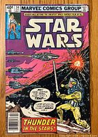 Front cover of Star Wars comic #34 showing space battle and character with helmet