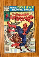 Front cover of The Amazing Spider-Man #209 comic book showing Spider-Man in action with a clawed opponent and promotional header for Toys 'R' Us shopping spree.