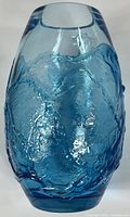 Front view of the blue Murano glass vase showing textured details and blue color.