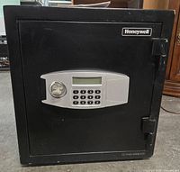 Front view of Honeywell steel safe showing digital keypad, key lock, and Honeywell logo.