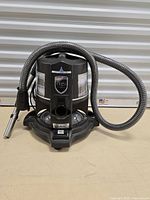 Overall view of the Rainbow vacuum showing the hose attached to the main unit.