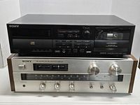 Sony TXD-R11 compact disc cassette deck and Sony STR-V1 FM stereo/FM-AM receiver side by side.