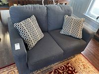 Front view of loveseat with both throw cushions in place