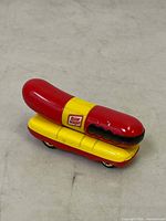 Oscar Mayer Hot Wheels hot dog toy car viewed from side angle showing logo and detail