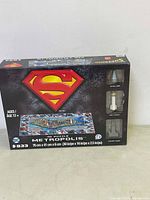Front of boxed 4D puzzle showing Superman logo and Metropolis puzzle details with 30 pieces and dimensions