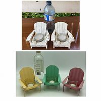 Set of three metal Adirondack chair votive candle holders in pastel yellow, green, and pink with glass votive cups, displayed in front of a bottle for scale comparison.