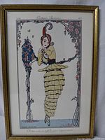 Full view of the framed 1914 'Costumes Parisiens 183' pochoir print featuring a stylized woman in early 20th century Parisian costume with floral decorative border.
