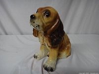 Front side view of the ceramic cocker spaniel planter in good condition.