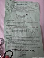 Photo of printed instructions for hanging the handwoven traditional rope hammock, including measurements and alternate locations