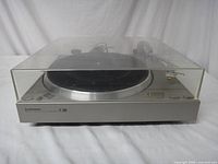 Front view of the Pioneer PL-3000 turntable with clear dust cover in closed position.