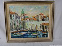 Full front image of framed oil painting depicting Dubrovnik harbor scene with boats and buildings.