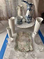 Wide view of lot showing Delftware ceramics and assorted white vases on a stand with glass toothpick holders and serving tray