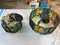 Two fixtures displayed on table, top and side views of both pieces