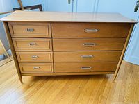 Front view of dresser showing six drawers and metal pulls