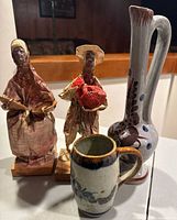 Two Mexican paper mache figurines (man and woman) with large Talavera ewer and ceramic mug