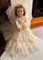 Vintage American Character Sweet Sue bridal doll standing, showing full length of white lace and tulle wedding dress and veil.