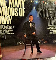Photo of vinyl record album cover featuring Tony Bennett, titled "The Many Moods of Tony"