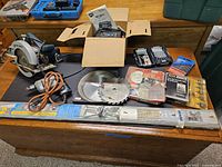 Overview of all table top workshop tools including circular saws, drill, blades, bits and cutters