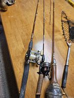Close-up of fishing rods and reels for detail and condition visibility