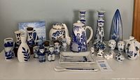 Full overview of all blue and white porcelain items arranged on table