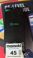 Front of the wireless CarPlay adapter packaging with CarPlay logo and icons